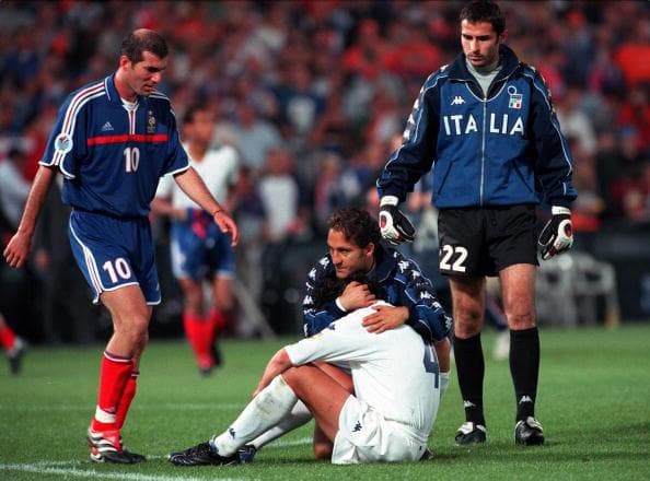 Alessandro Del Piero is consoled by team-mates Francesco Totti and Francesco Antonioli, as Frances Zinedine Zidane offers his sympathy