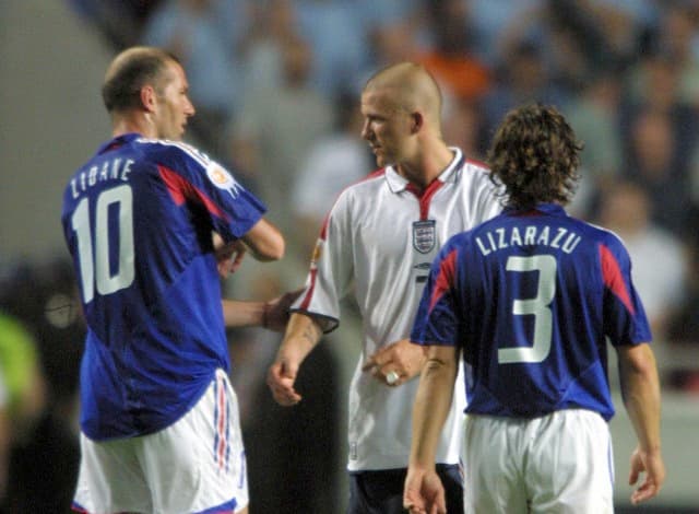 David Beckham (England) is consoled by Zinedine Zidane at the final whistle . England v France. Euro Championships 2004.