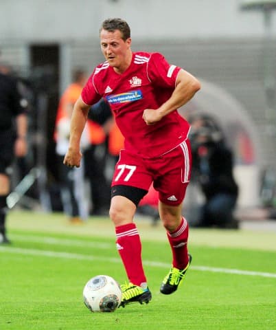 Former Formula One driver Michael Schumacher is pictured during Michael Ballack's farewell match at Red Bull Arena in Leipzig, Germany, 05 June 2013.