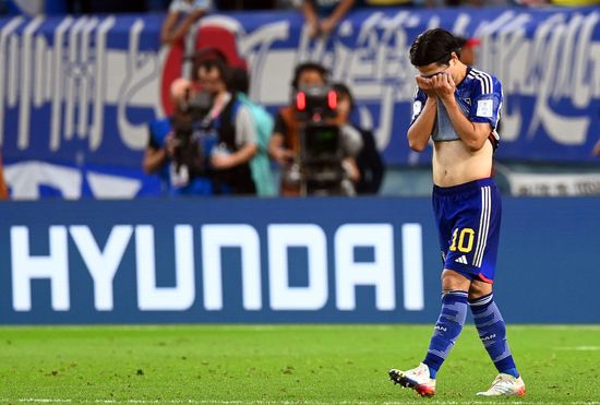 عکس از تاکومی مینامینو هافبک هجومی ژاپن در جام جهانی ۲۰۲۲