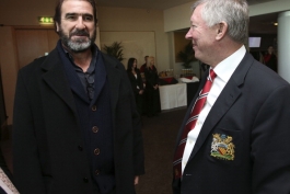 Eric Cantona talks with Sir Alex Ferguson after the unveiling of a statue of Manager Sir Alex Ferguson of Manchester United at Old Trafford on November 23, 2012 in Manchester, England