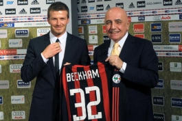 December 20, 2008 shows British footballer David Beckham (L) holding an AC Milan jersey at an official presentation with club president Adriano Galliani at the San Siro stadium in Milan