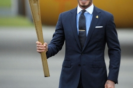 David Beckham With The London 2012 Olympic Games Flame At Royal Naval Air Station